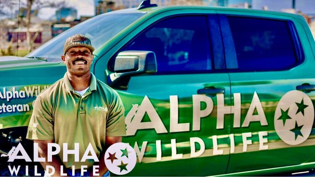 Alpha Wildlife Technician standing in front of his truck in Lakeland, TN